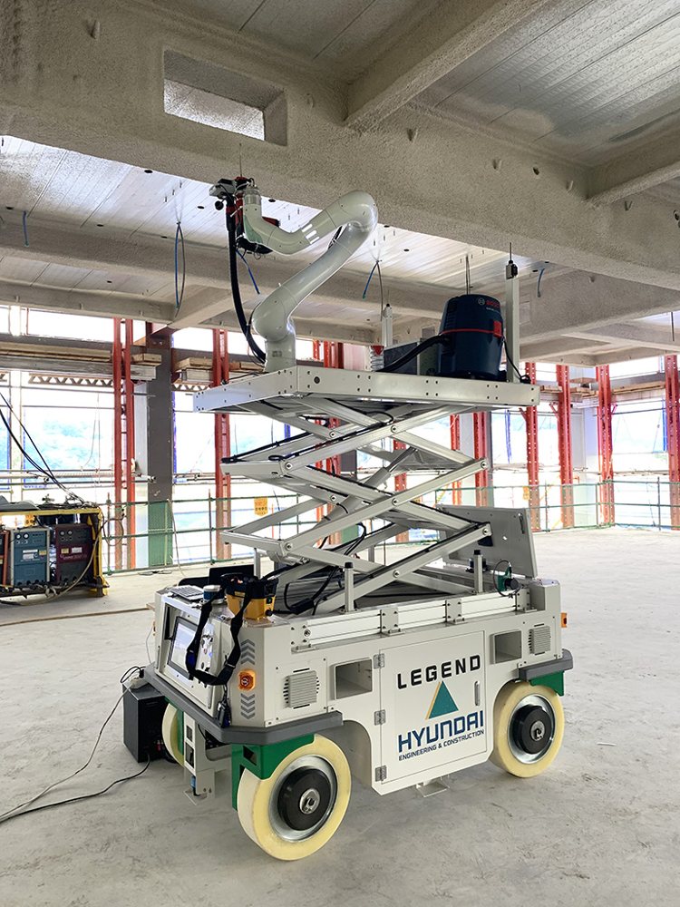Unmanned ceiling-drilling construction robot